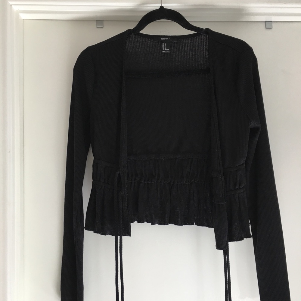 Black short sweater, ties in front. Size M